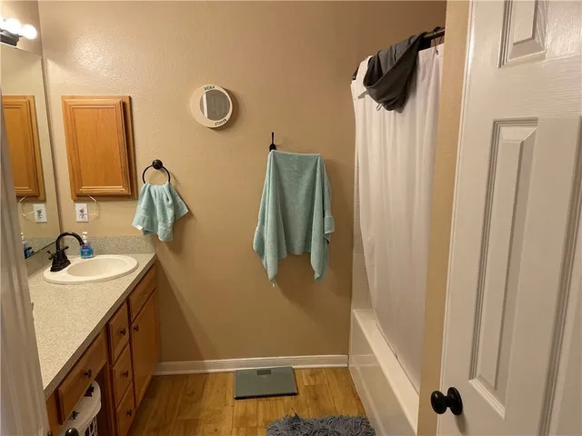 a bathroom with a sink and mirror
