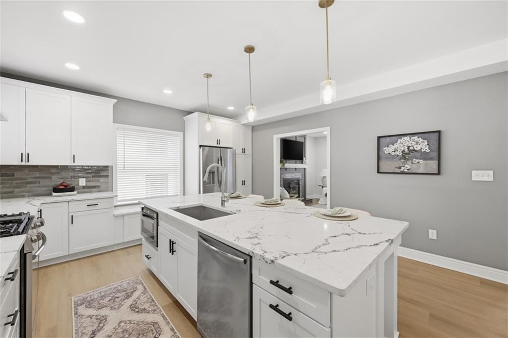 338 4th Street Beaver, PA 15009 - Photo 16 of 50 a kitchen that has a sink a stove and a table