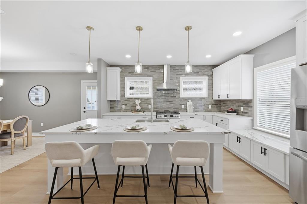 338 4th Street Beaver, PA 15009 - Photo 17 of 50 a kitchen with stainless steel appliances kitchen island granite countertop a sink a stove a dining table and chairs