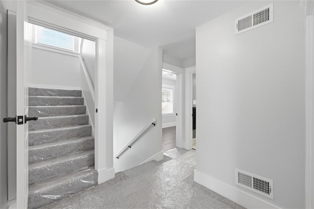 338 4th Street Beaver, PA 15009 - Photo 23 of 50 a view of front door with hallway and stairs