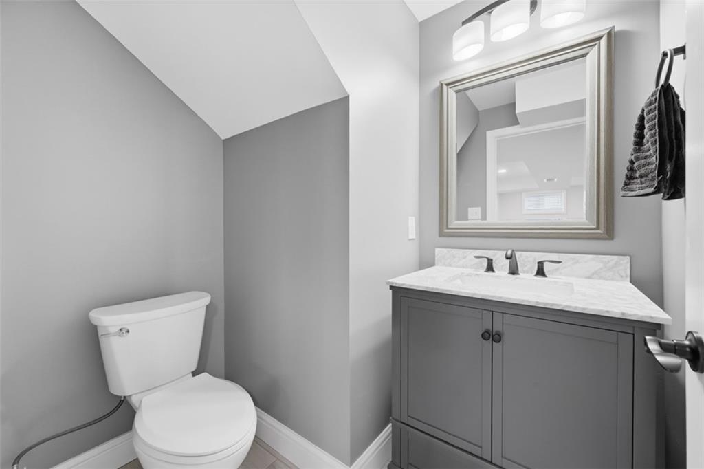 338 4th Street Beaver, PA 15009 - Photo 41 of 50 a bathroom with a toilet a sink and mirror