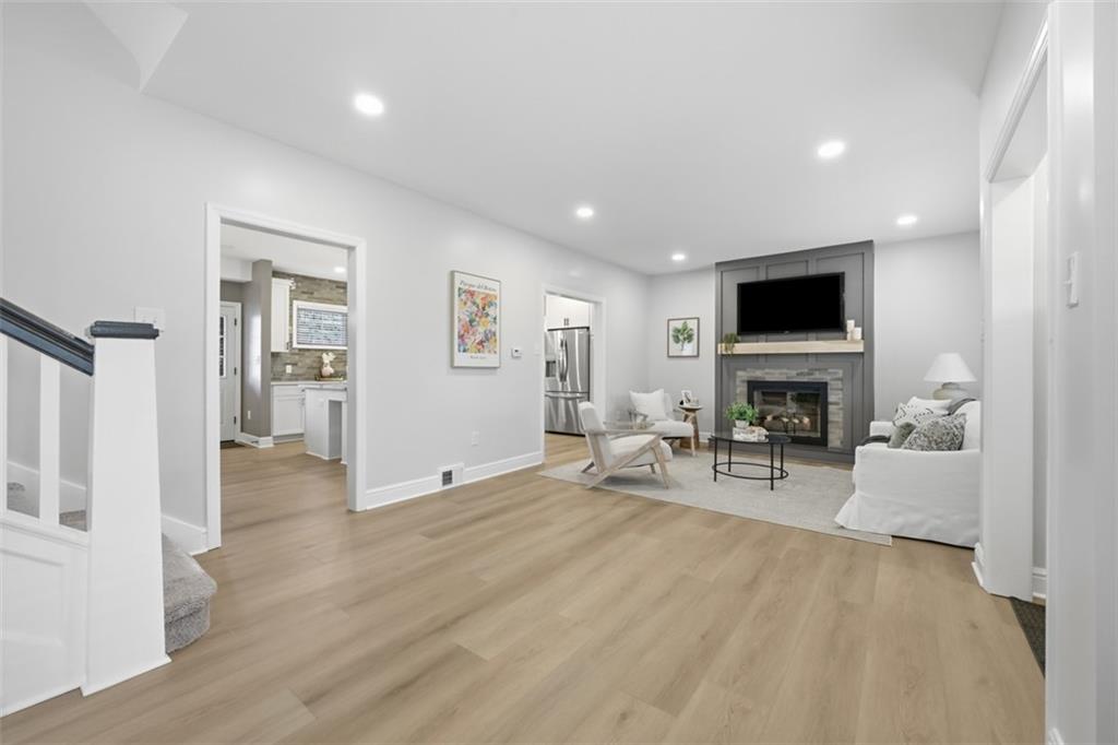 338 4th Street Beaver, PA 15009 - Photo 7 of 50 a living room with furniture a fireplace and a flat screen tv