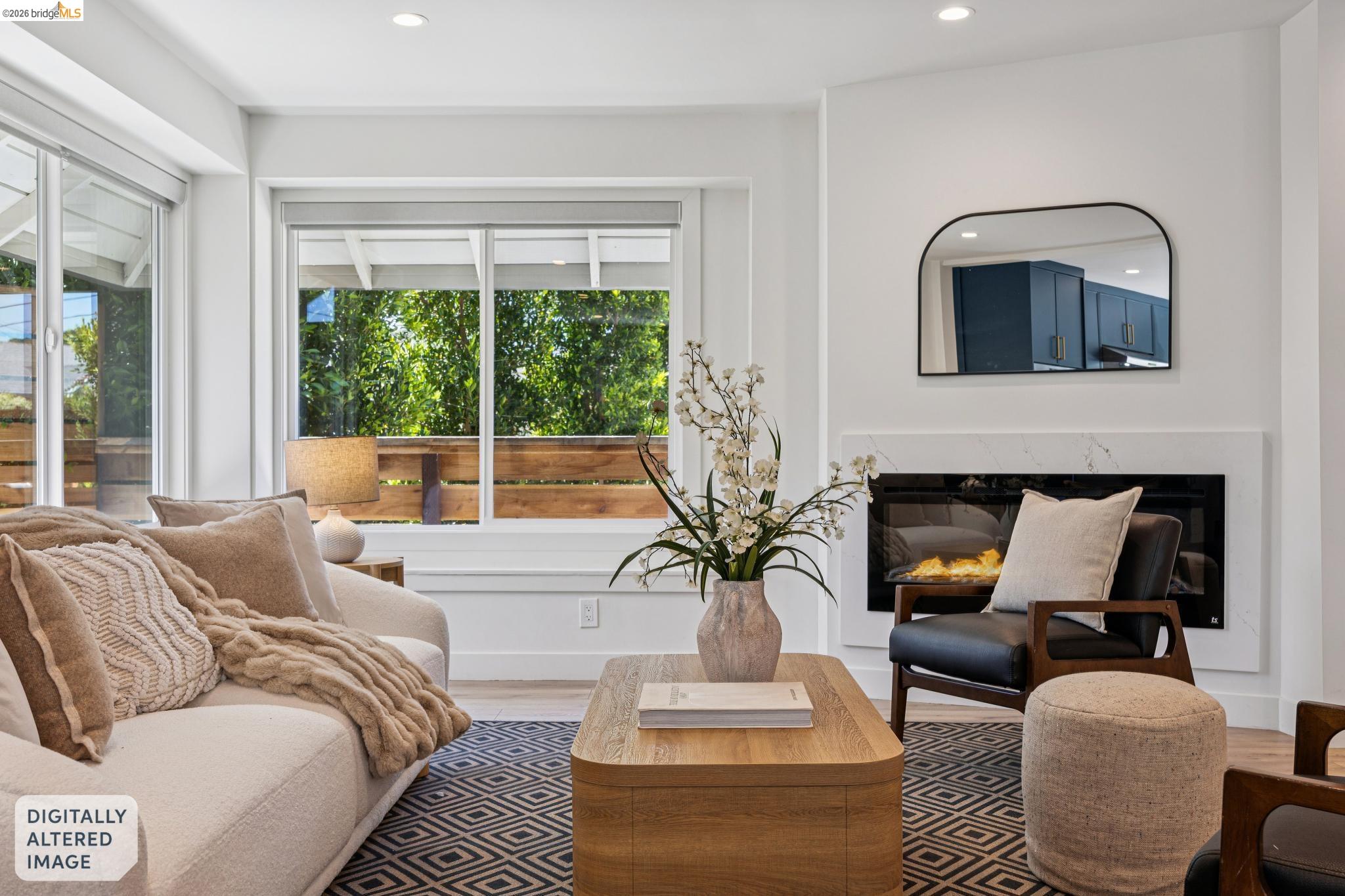 11 Belinda Court San Ramon, CA 94583 - Photo 7 of 33 Contemporary living space featuring a built-in linear fireplace with a white stone surround, expansive windows, wood-finish flooring, recessed lighting, and sliding glass doors