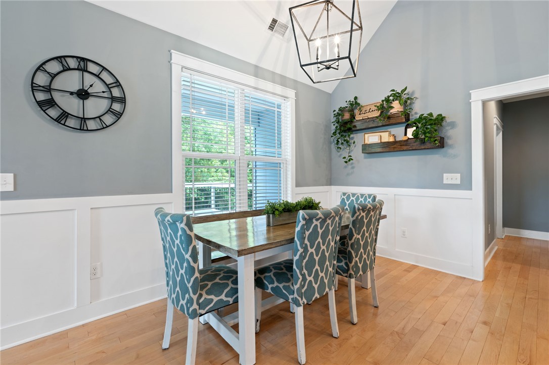1050 Old Dacusville Road Easley, SC 29640 - Photo 13 of 33 This bright dining area features vaulted ceilings and light wood flooring, perfect for entertaining.