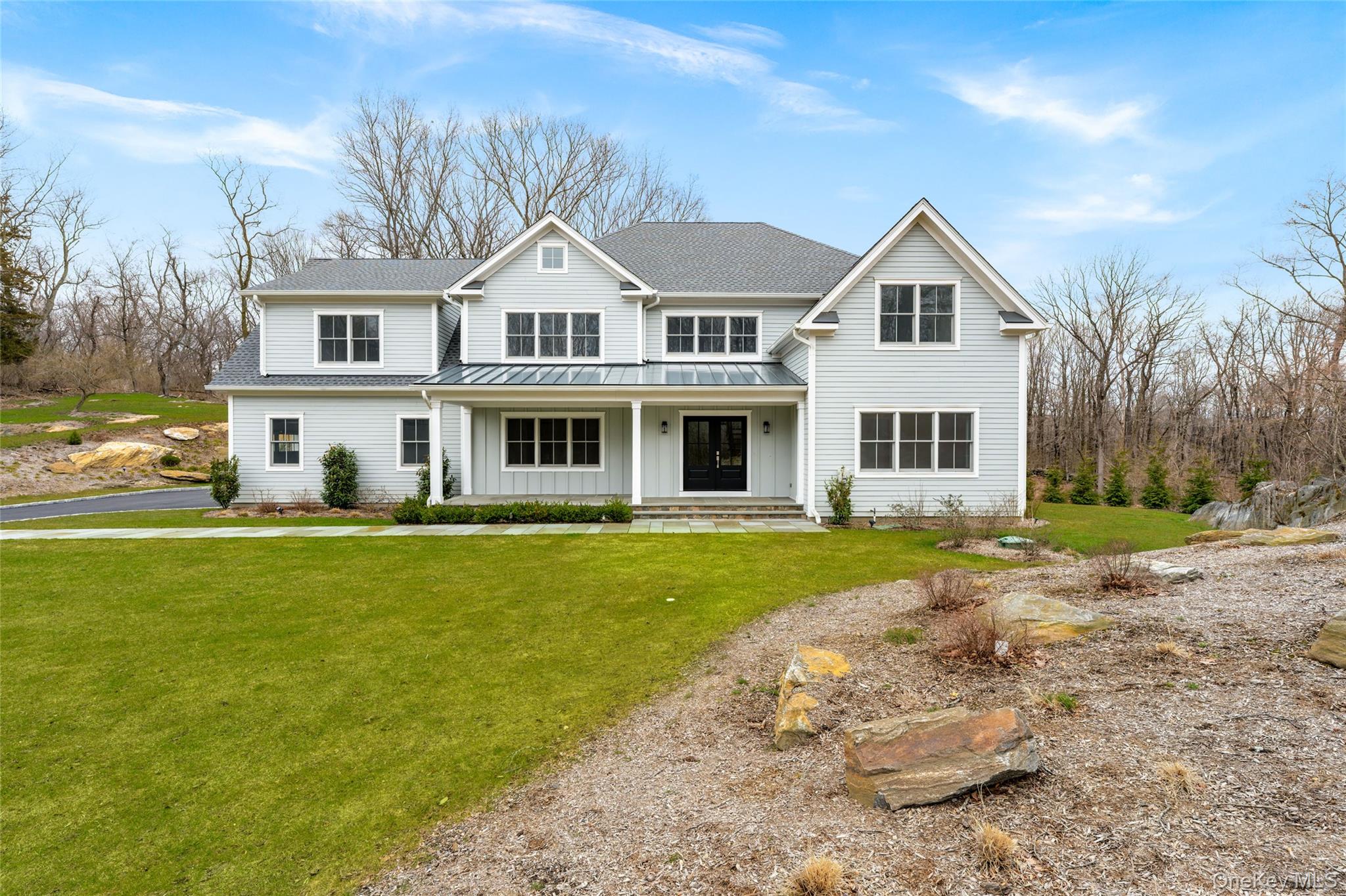 63 Buckout Road West Harrison, NY 10604 - Photo 1 of 34 a view of a white house with a yard