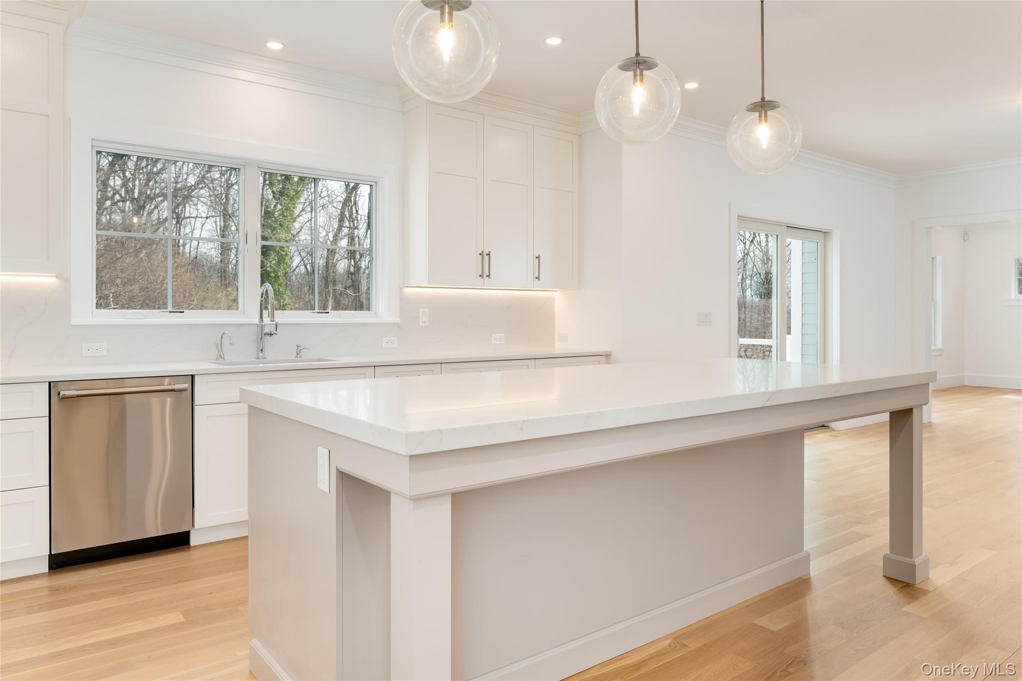 63 Buckout Road West Harrison, NY 10604 - Photo 12 of 34 a kitchen with stainless steel appliances granite countertop a sink a window and a counter space