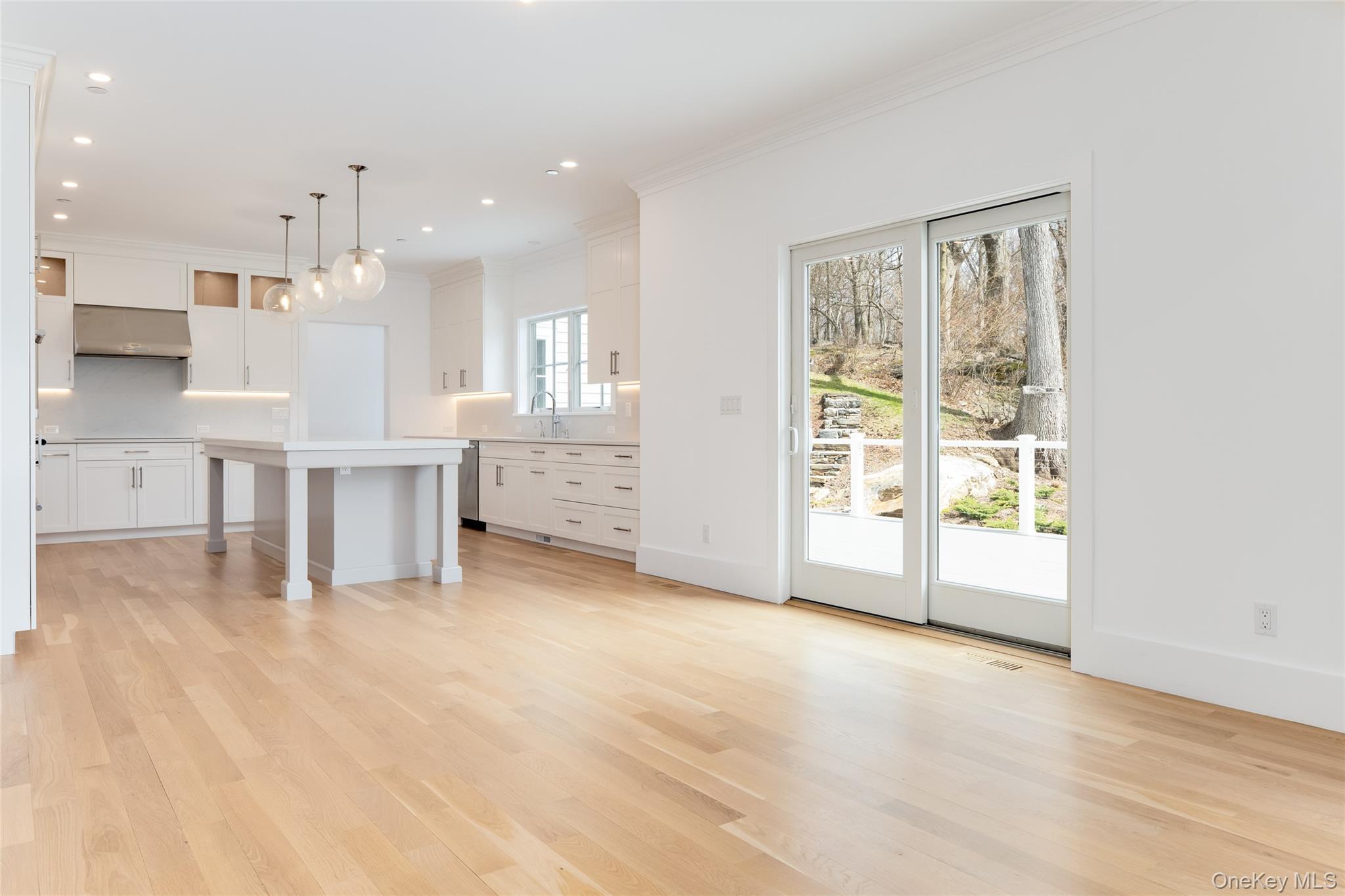 63 Buckout Road West Harrison, NY 10604 - Photo 14 of 34 a view of an empty room with a kitchen