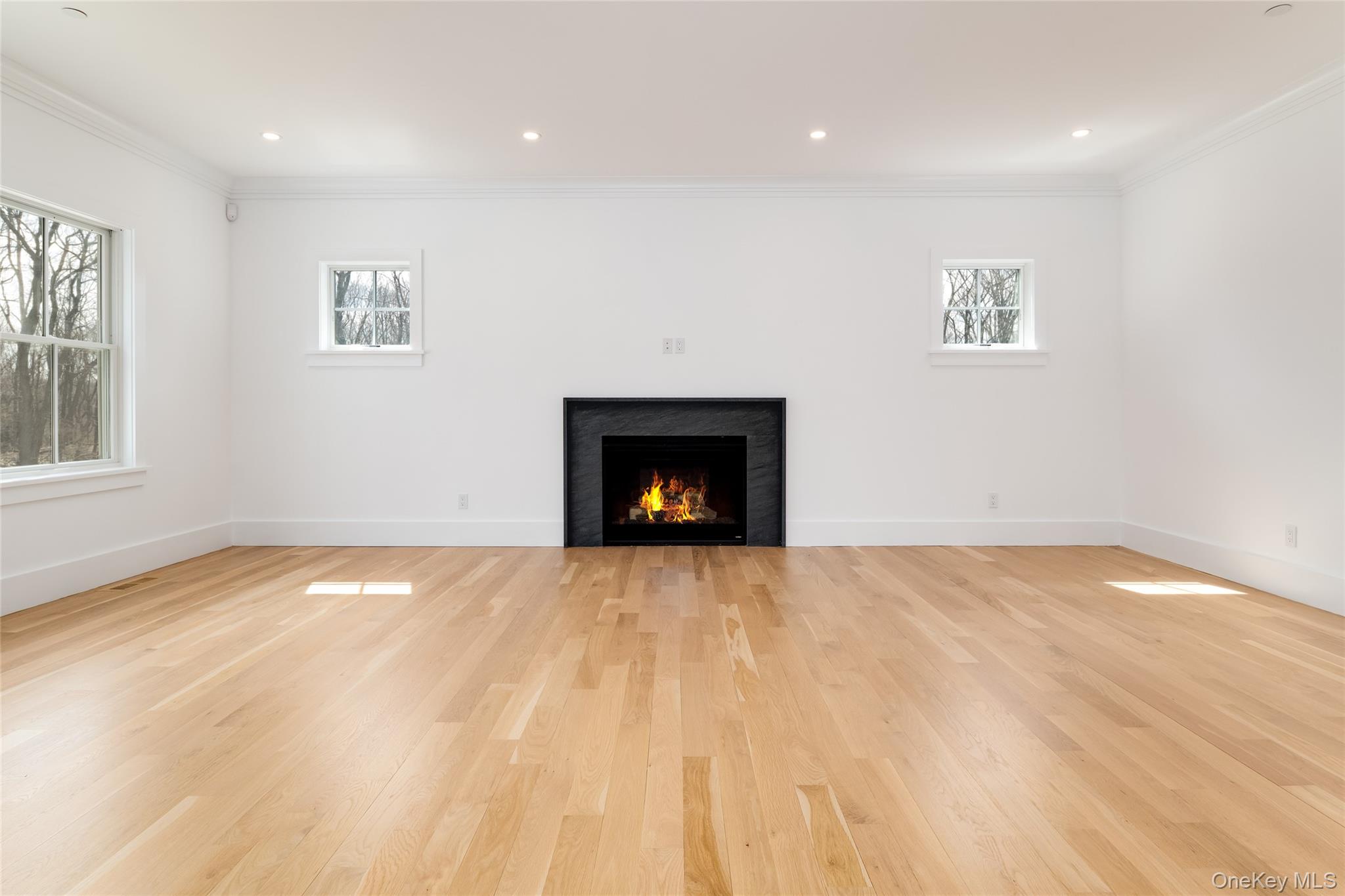 63 Buckout Road West Harrison, NY 10604 - Photo 15 of 34 a view of an empty room with wooden floor and a window