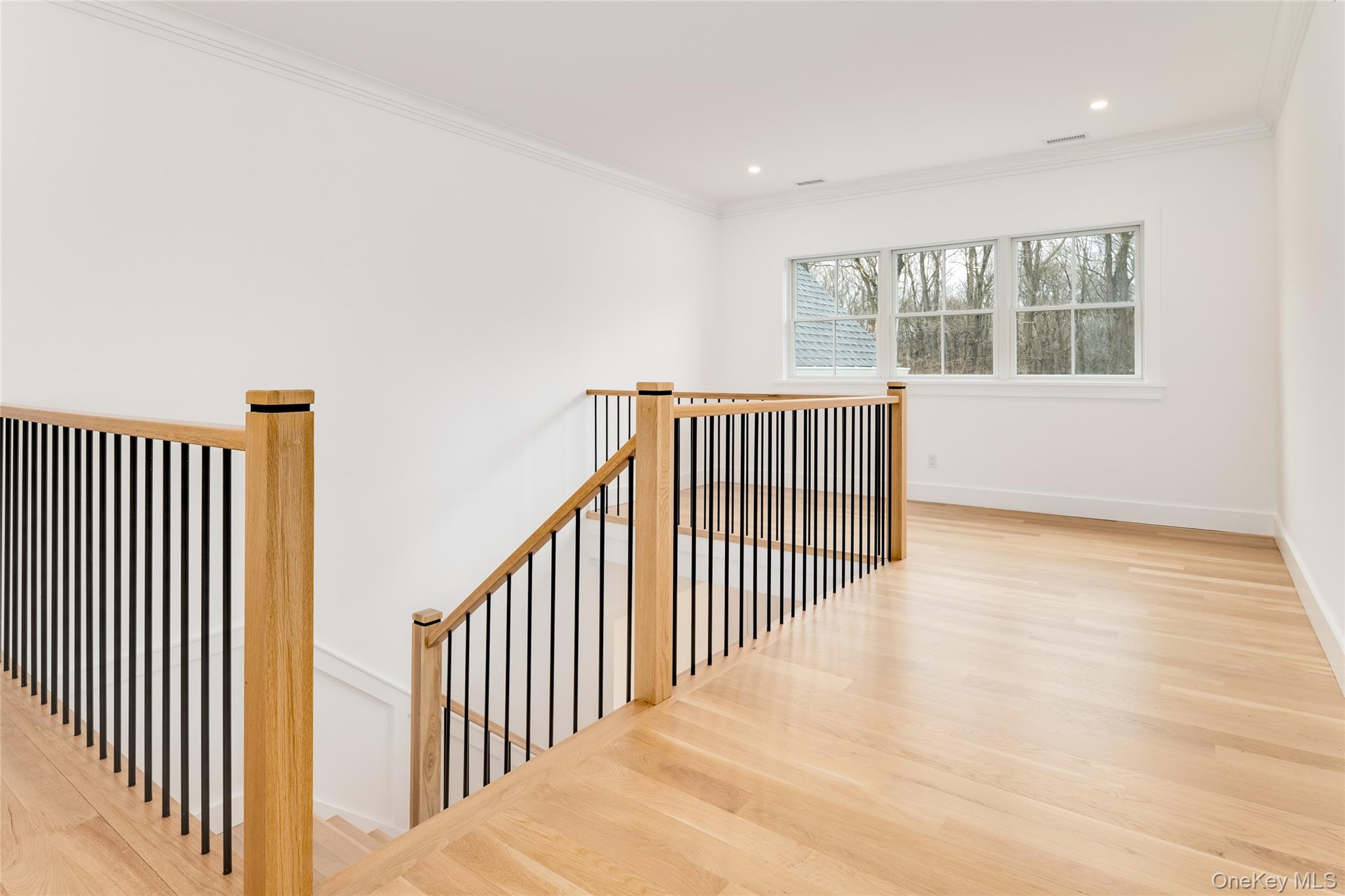63 Buckout Road West Harrison, NY 10604 - Photo 17 of 34 a view of a room with wooden floor and windows