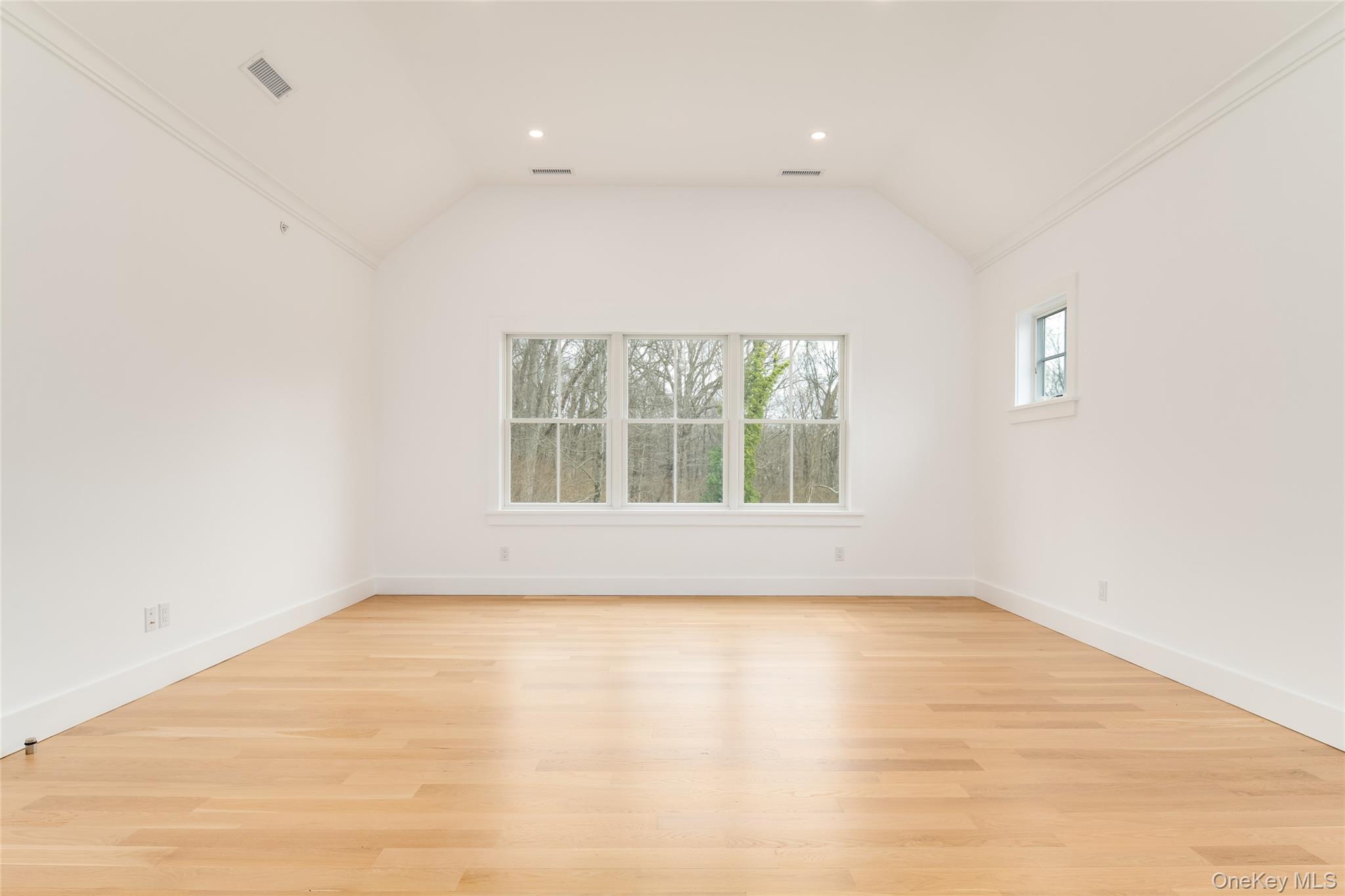63 Buckout Road West Harrison, NY 10604 - Photo 19 of 34 an empty room with wooden floor and windows
