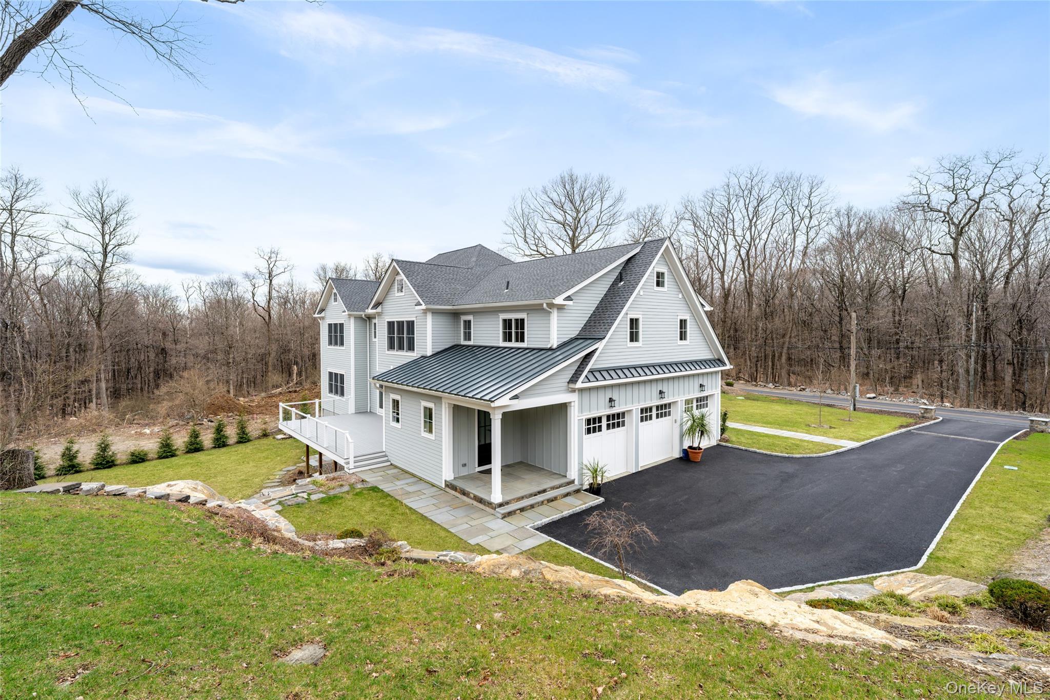 63 Buckout Road West Harrison, NY 10604 - Photo 30 of 34 a aerial view of a house with a yard and roof
