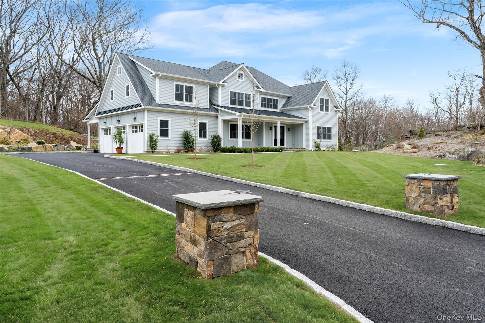 63 Buckout Road West Harrison, NY 10604 - Photo 3 of 34 a front view of a house with a garden and yard