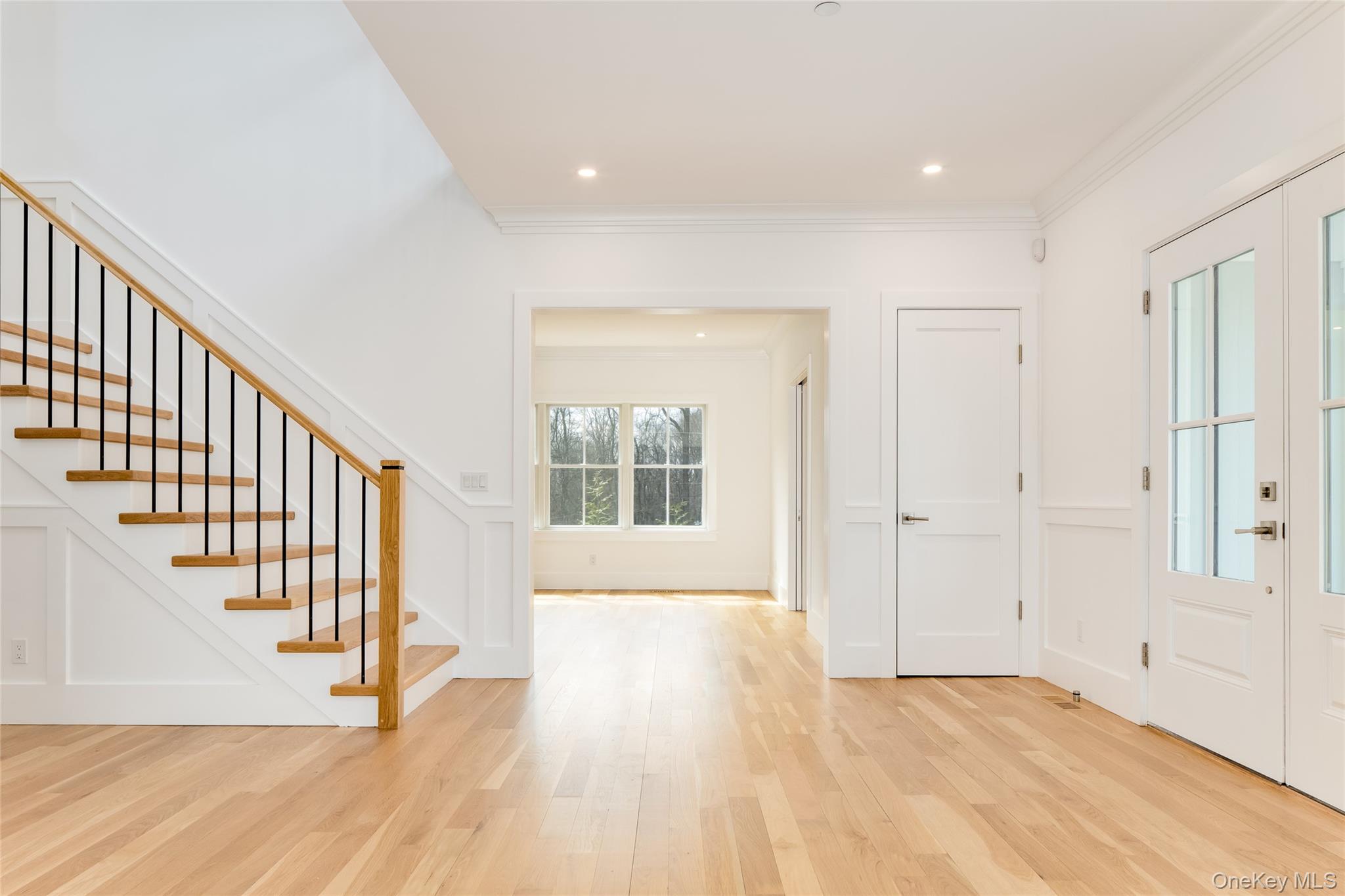 63 Buckout Road West Harrison, NY 10604 - Photo 5 of 34 a view of an empty room with wooden floor and stairs