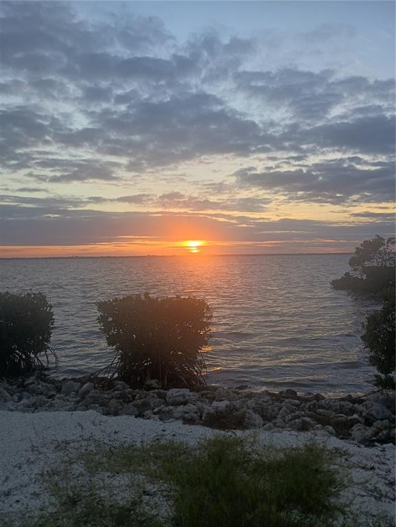 2800 Harbourside Drive, Unit E03 Longboat Key, FL 34228 - Photo 11 of 13 a view of an ocean and beach