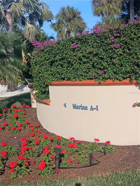 2800 Harbourside Drive, Unit E03 Longboat Key, FL 34228 - Photo 4 of 13 a view of yard with flowers and flowers
