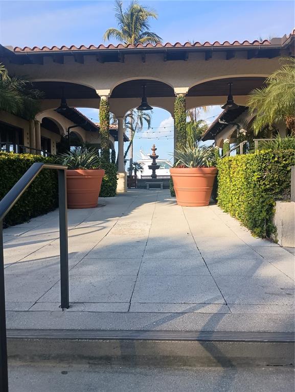 2800 Harbourside Drive, Unit E03 Longboat Key, FL 34228 - Photo 6 of 13 a view of a porch and a potted plants