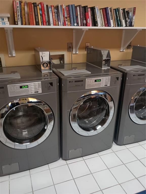 2800 Harbourside Drive, Unit E03 Longboat Key, FL 34228 - Photo 10 of 13 a utility room with dryer and washer