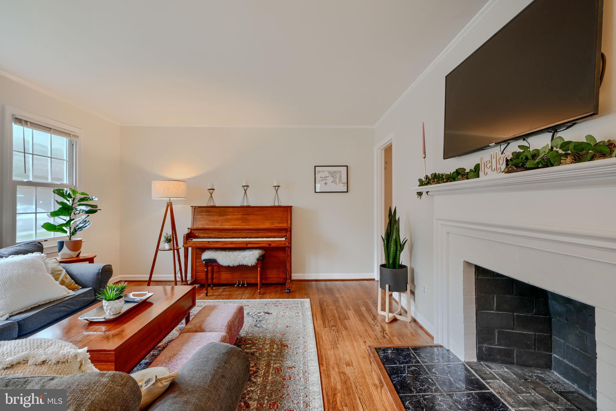 8808 Wolverton Road Baltimore, MD 21234 - Photo 11 of 57 a living room with furniture and a fireplace