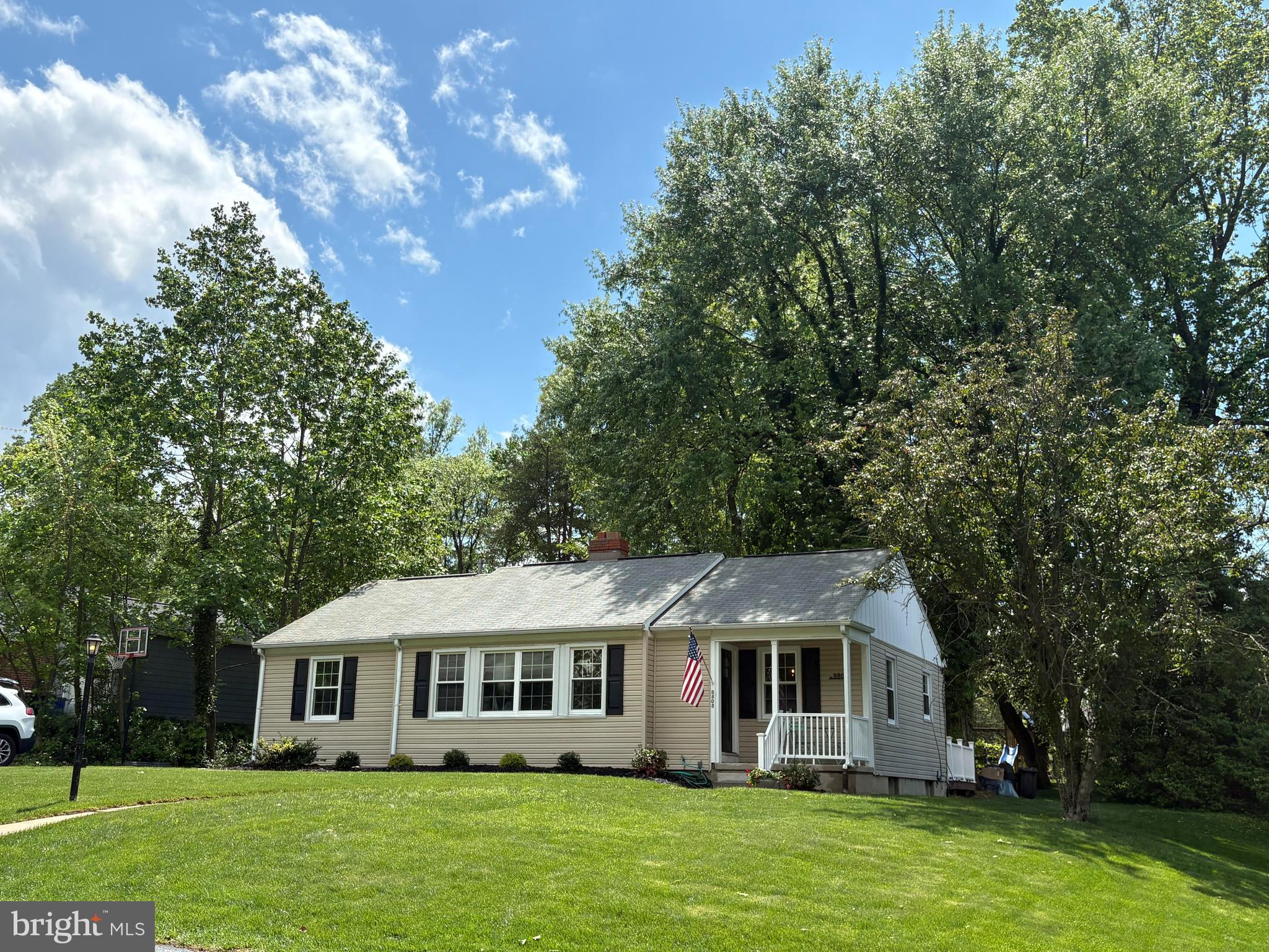 8808 Wolverton Road Baltimore, MD 21234 - Photo 2 of 57 a front view of a house with a garden