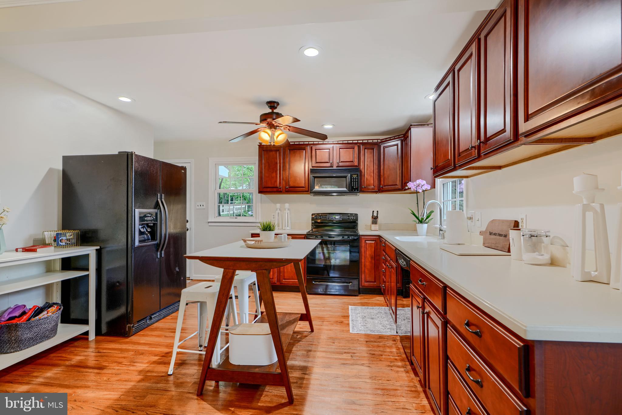 8808 Wolverton Road Baltimore, MD 21234 - Photo 21 of 57 a kitchen with stainless steel appliances granite countertop a sink stove and refrigerator