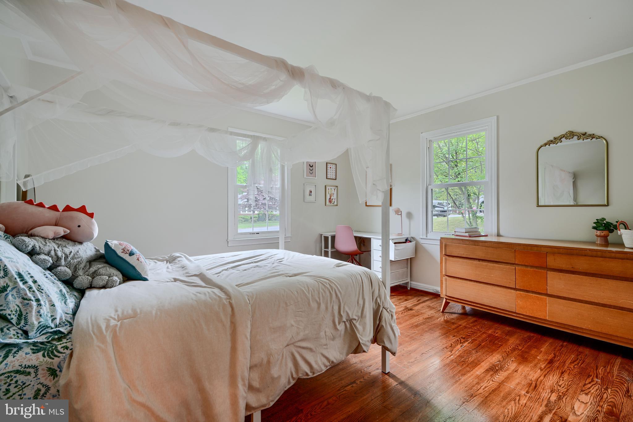 8808 Wolverton Road Baltimore, MD 21234 - Photo 22 of 57 a bedroom with two beds and a dresser