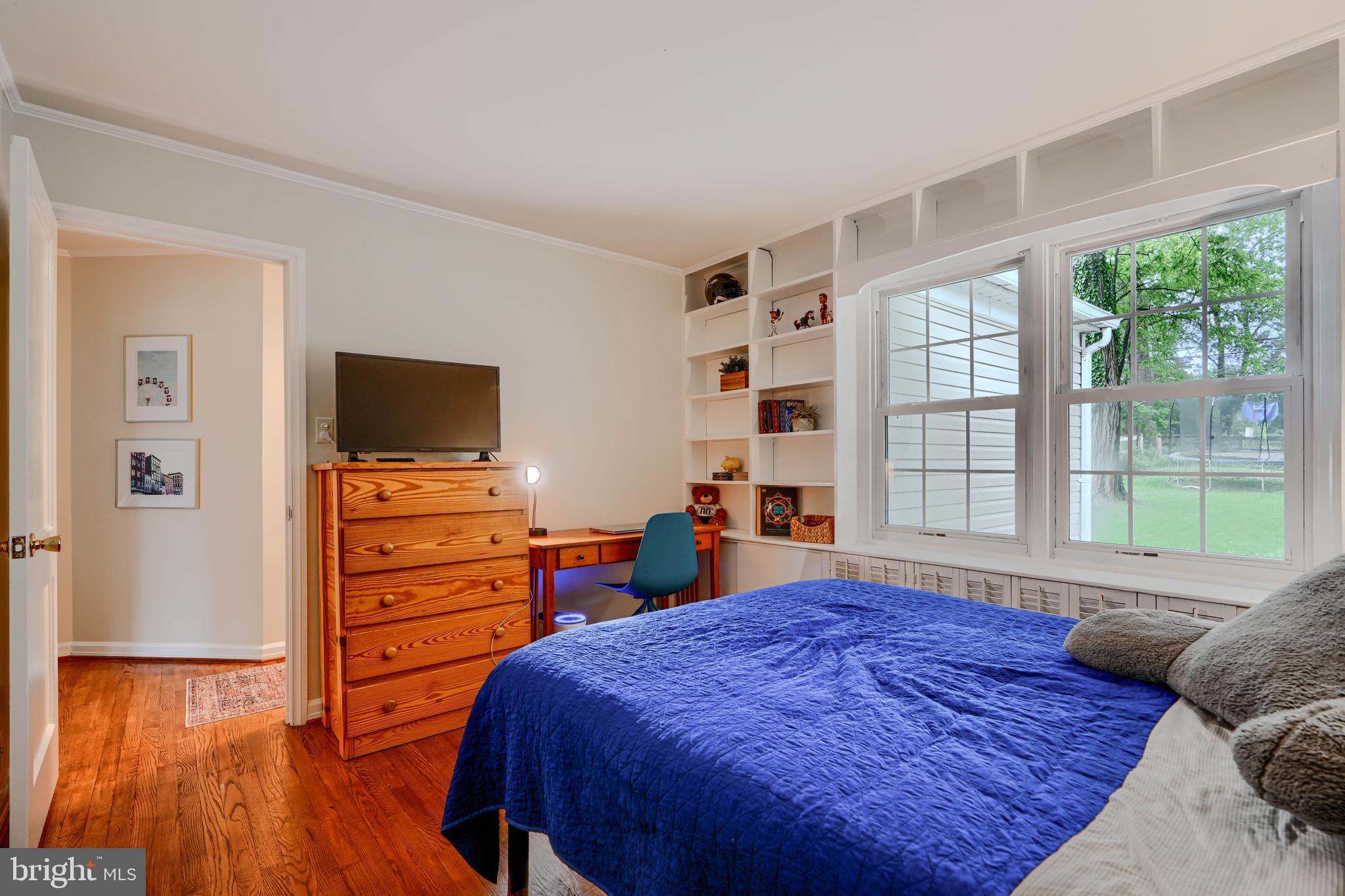 8808 Wolverton Road Baltimore, MD 21234 - Photo 28 of 57 a bedroom with a bed and a flat screen tv