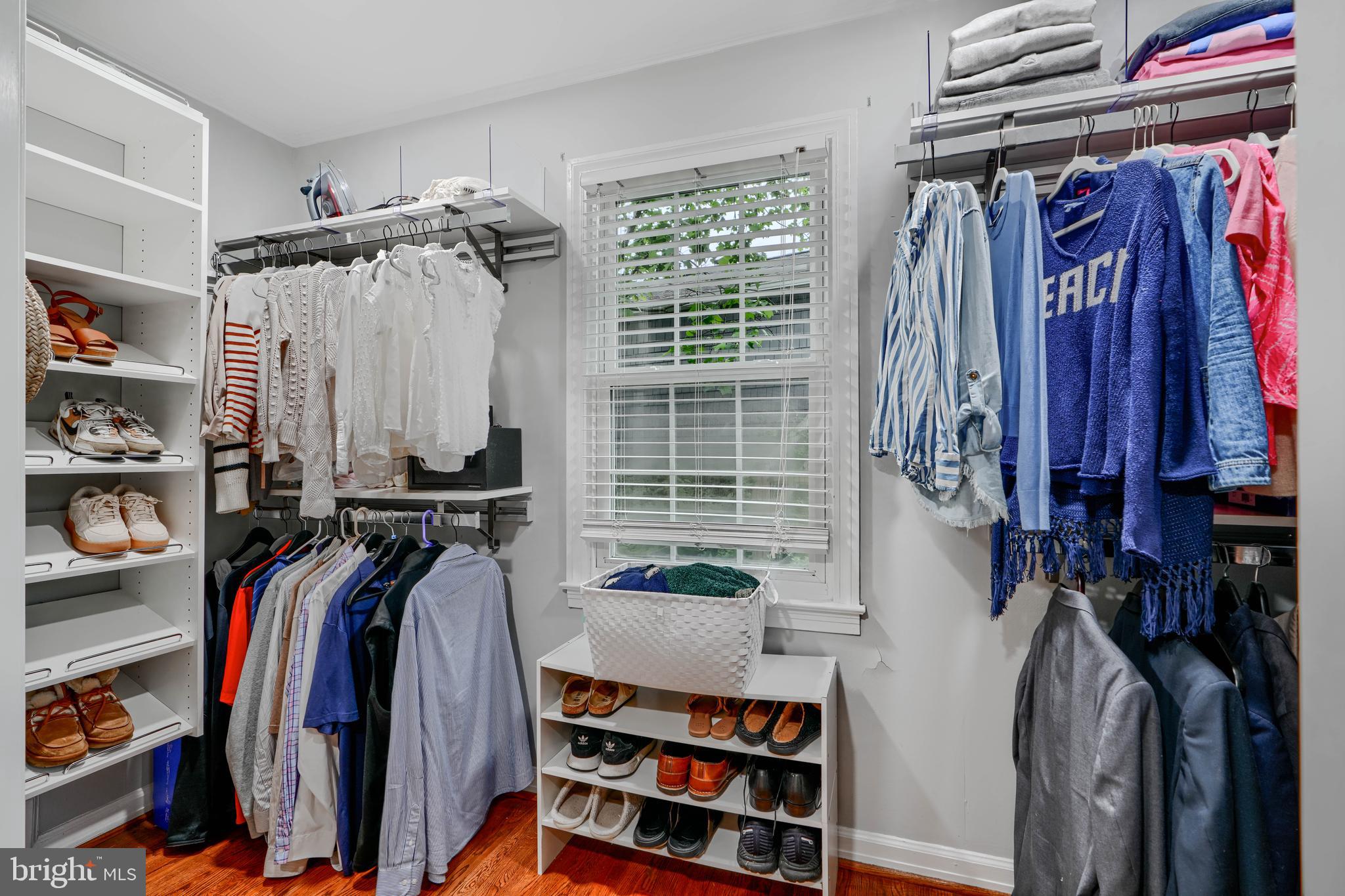 8808 Wolverton Road Baltimore, MD 21234 - Photo 30 of 57 a view of walk in closet with clothes and shoes