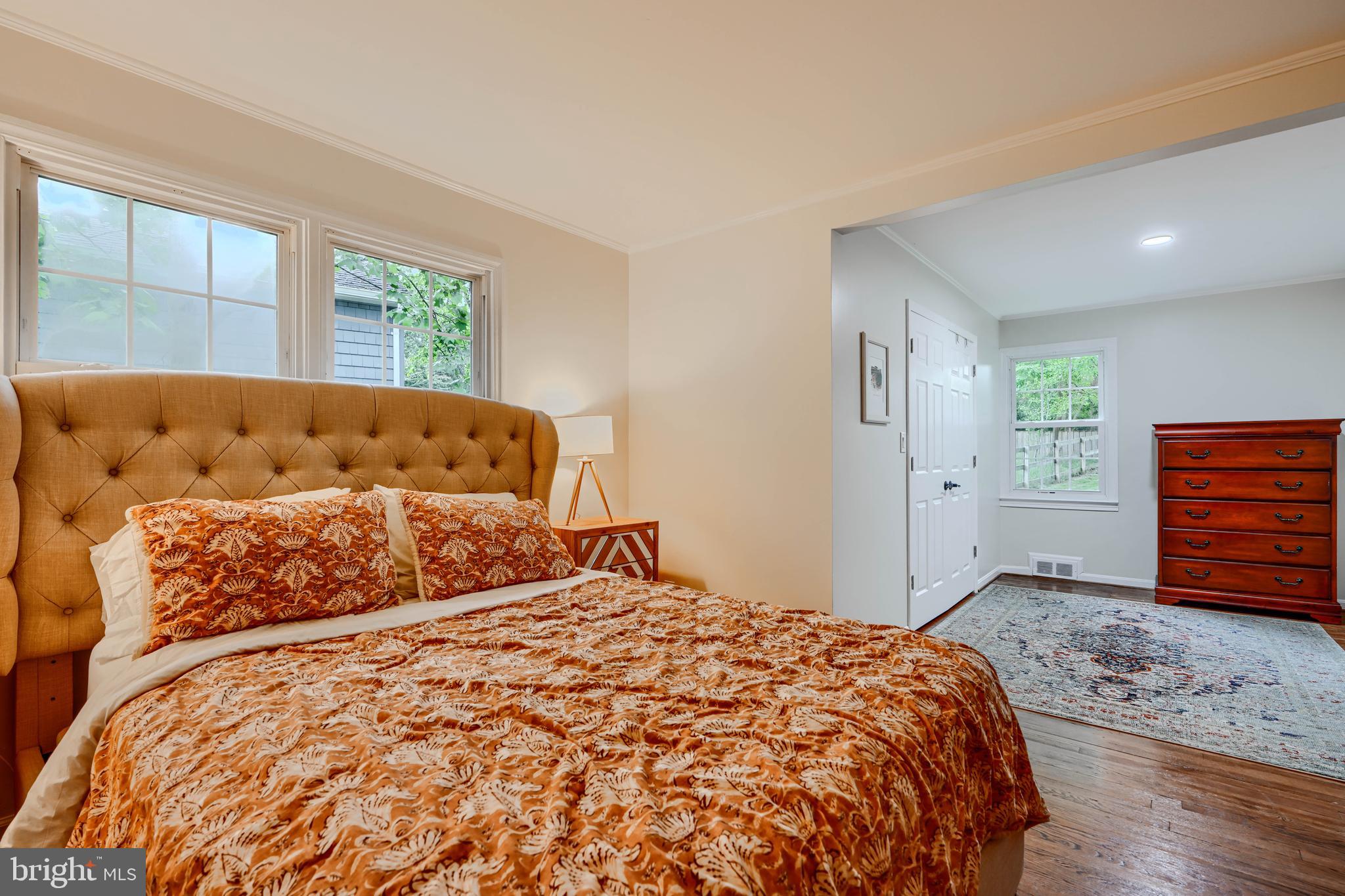 8808 Wolverton Road Baltimore, MD 21234 - Photo 32 of 57 a bed sitting in a spacious bedroom next to a window