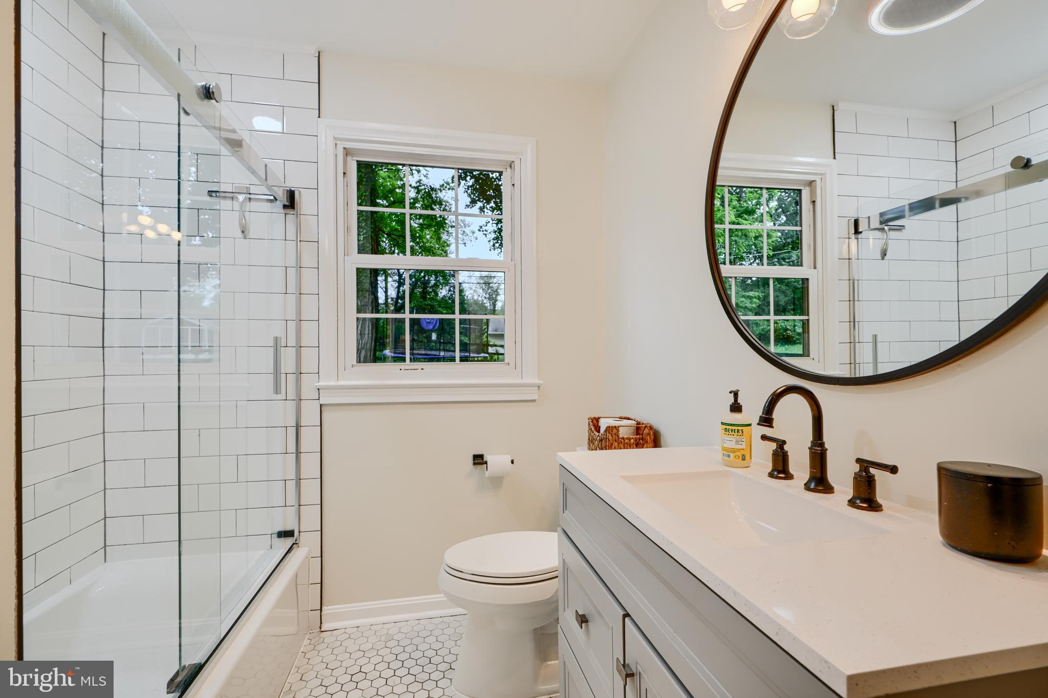 8808 Wolverton Road Baltimore, MD 21234 - Photo 35 of 57 a bathroom with a sink a toilet and shower