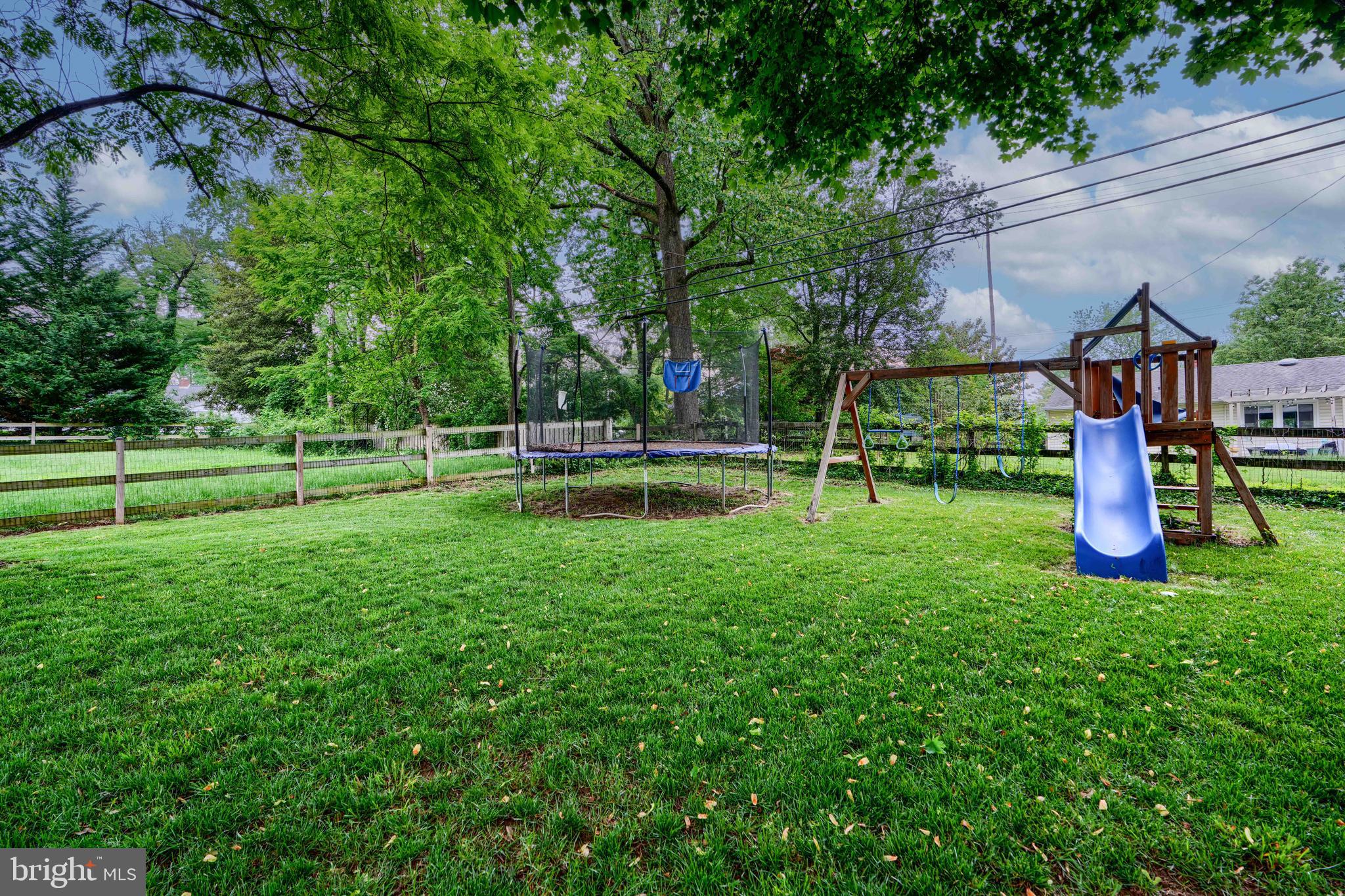 8808 Wolverton Road Baltimore, MD 21234 - Photo 4 of 57 a view of a park with swings and a table