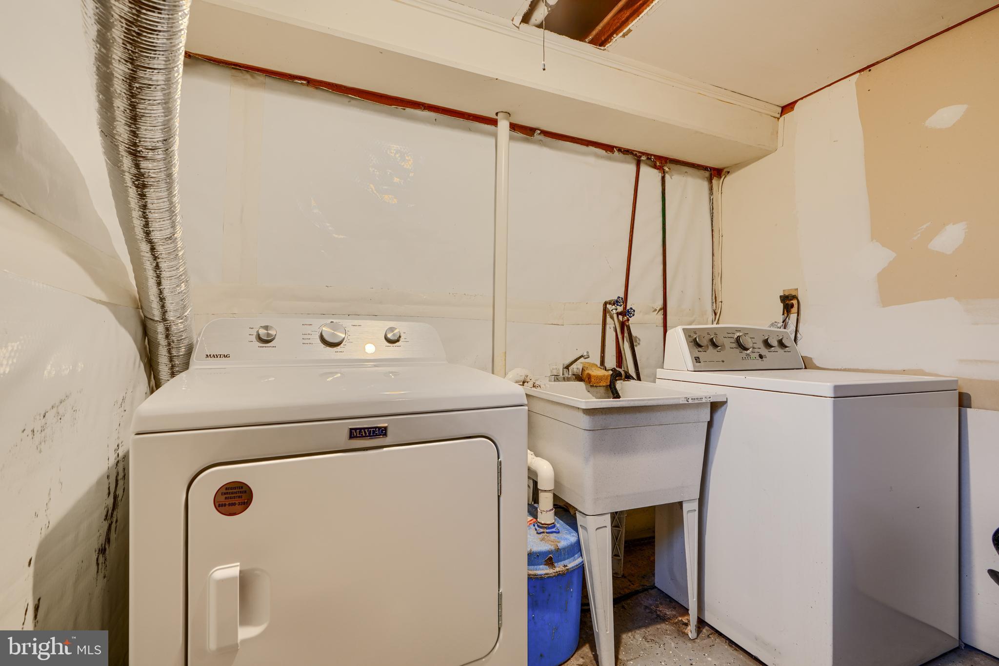 8808 Wolverton Road Baltimore, MD 21234 - Photo 46 of 57 a utility room with dryer and washer