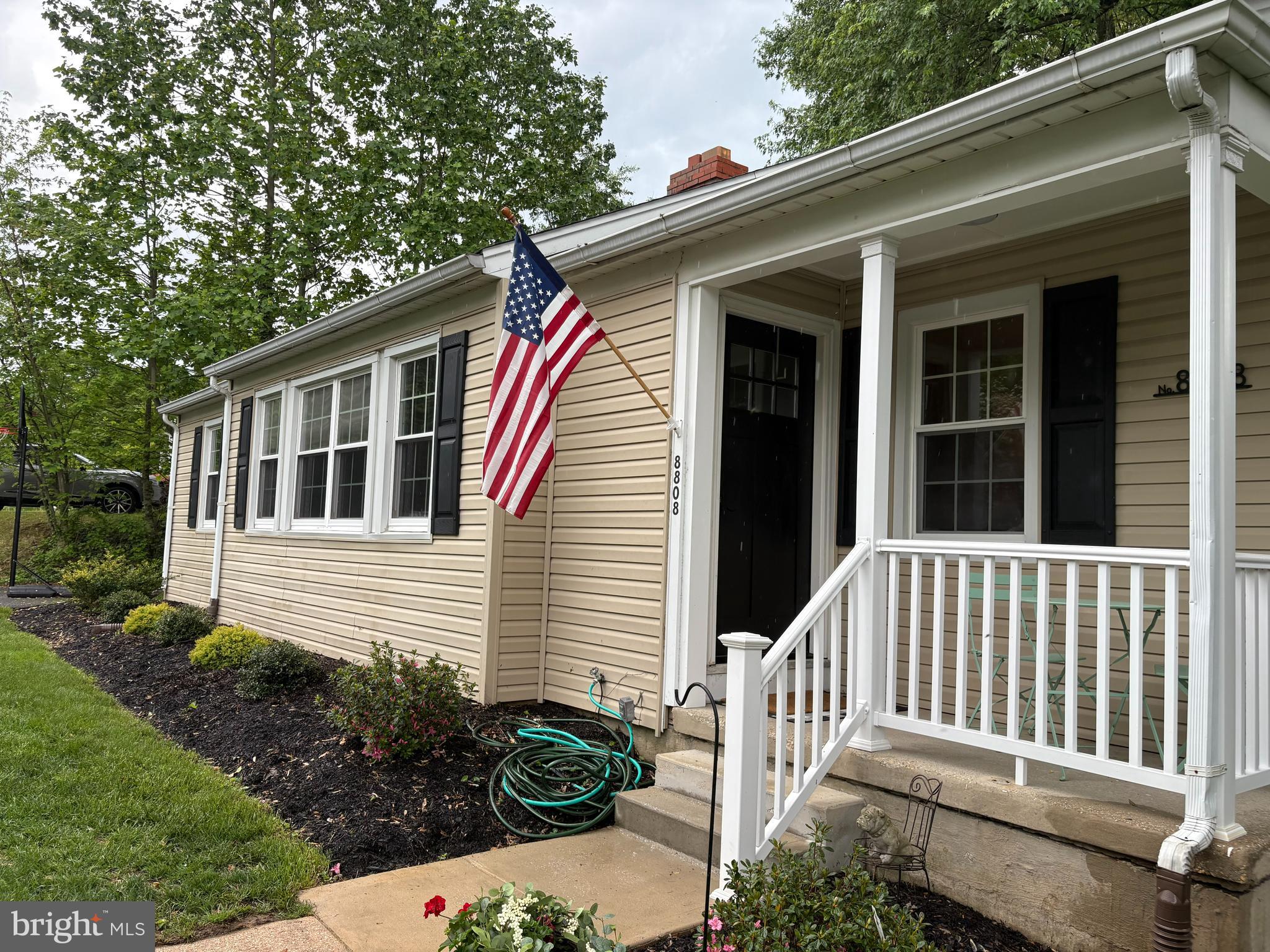 8808 Wolverton Road Baltimore, MD 21234 - Photo 5 of 57 a front view of a house with a garden