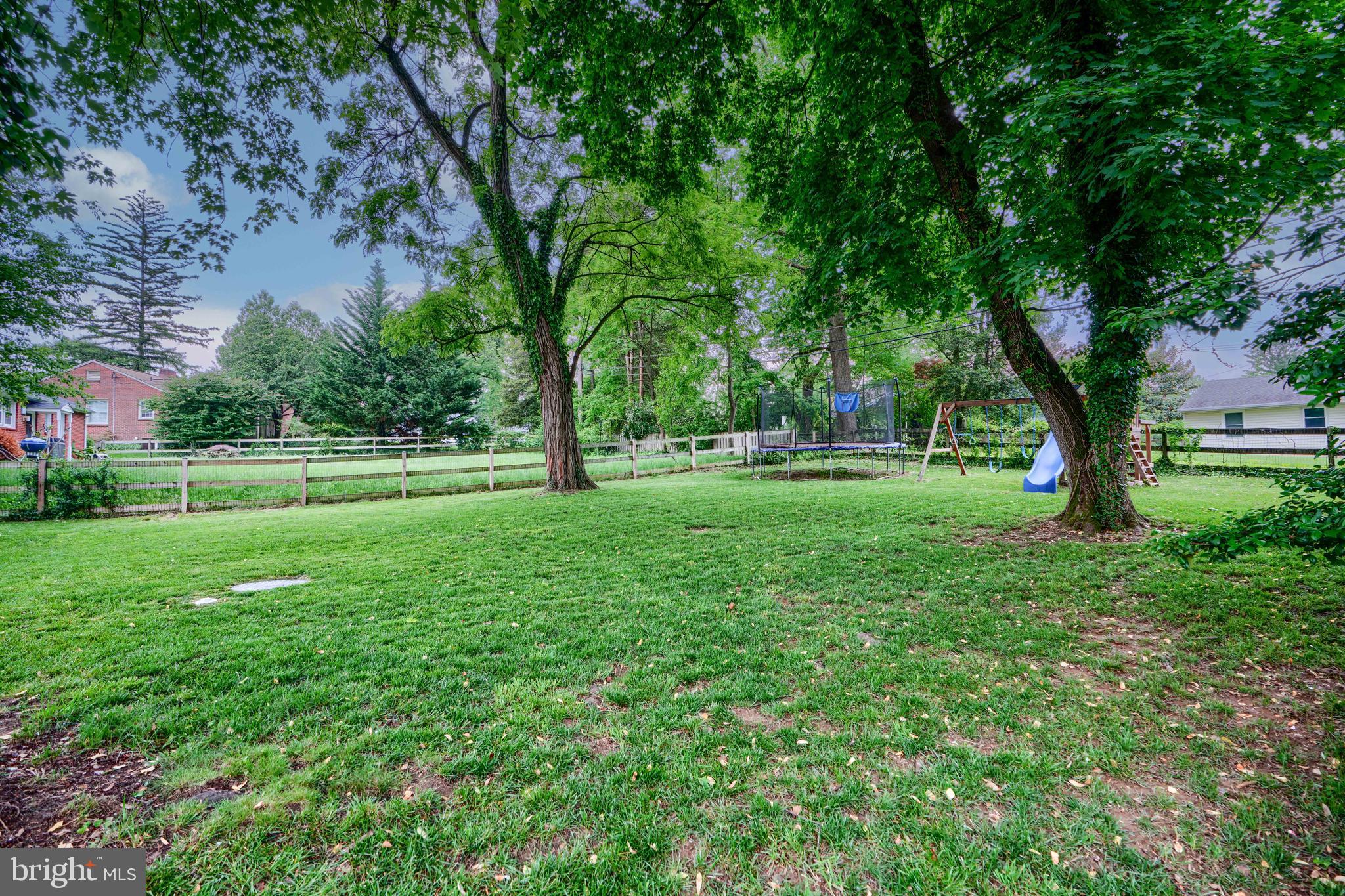 8808 Wolverton Road Baltimore, MD 21234 - Photo 52 of 57 a view of grassy field with benches and trees all around