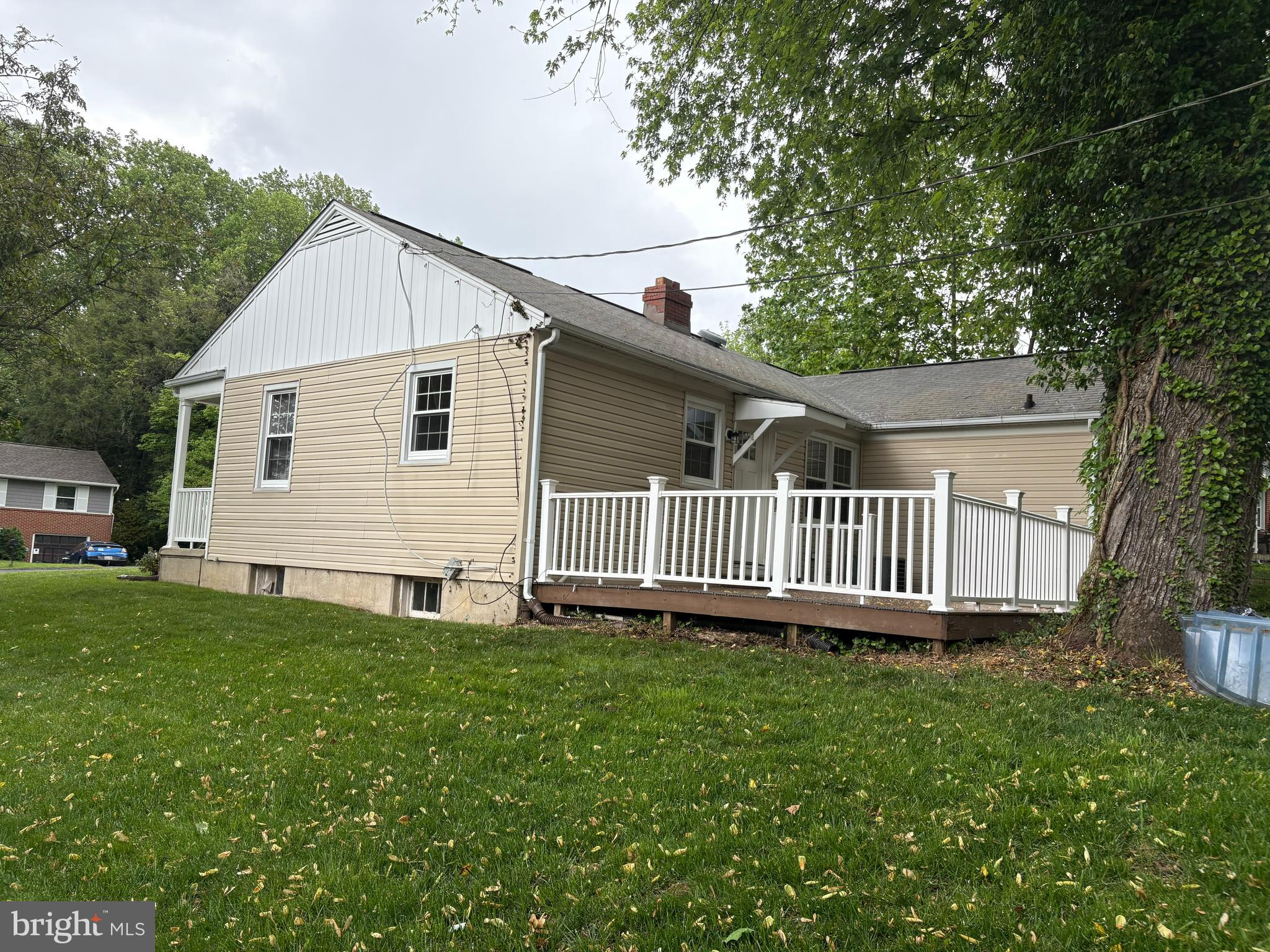 8808 Wolverton Road Baltimore, MD 21234 - Photo 57 of 57 a view of a house with a yard and deck
