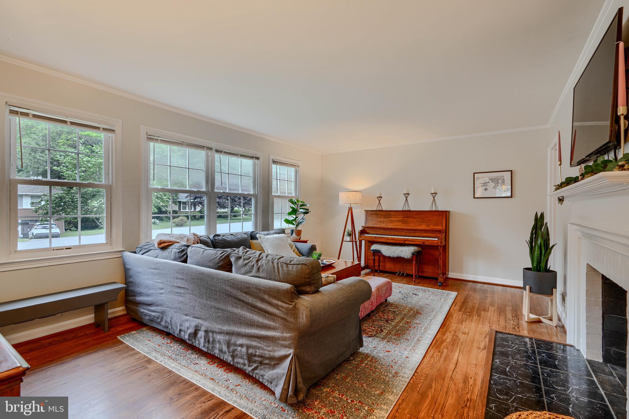 8808 Wolverton Road Baltimore, MD 21234 - Photo 10 of 57 a living room with furniture fireplace and a flat screen tv