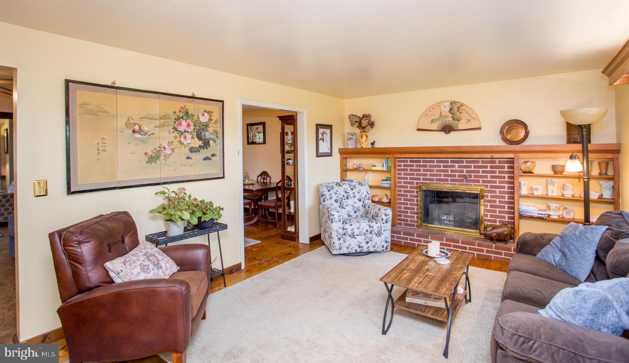 458 Rolling Hills Road Ottsville, PA 18942 - Photo 13 of 60 Wood burning fireplace with built-in bookcases