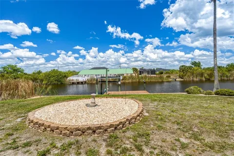 a view of a swimming pool with an outdoor space and lakeside