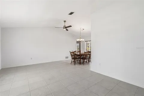 an empty room with furniture and white walls