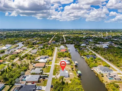 an aerial view of residential building and lake