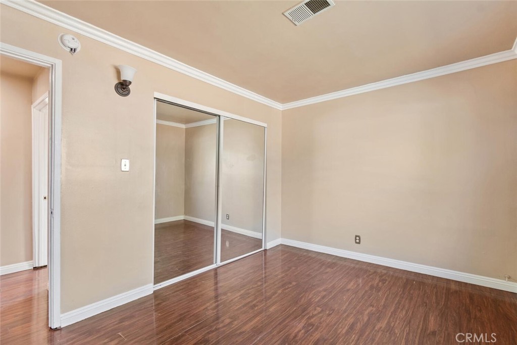 13438 Mercer Street Pacoima, CA 91331 - Photo 17 of 39 a view of an empty room with wooden floor