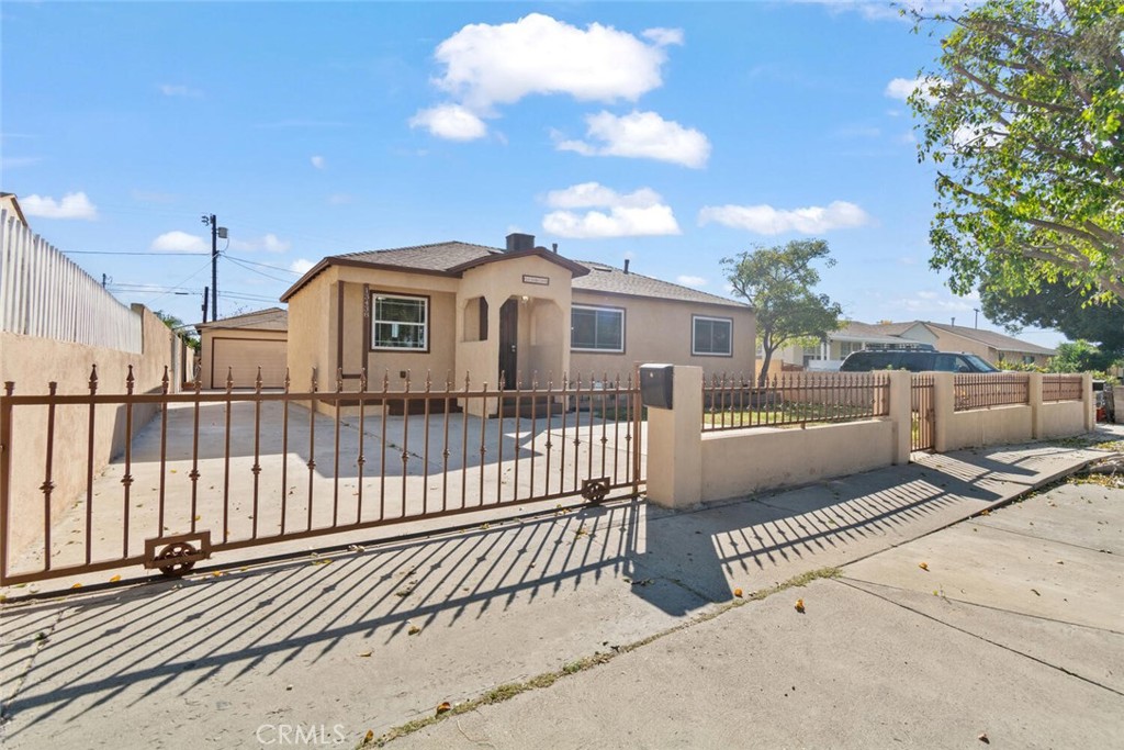 13438 Mercer Street Pacoima, CA 91331 - Photo 2 of 39 a view of a house with a wooden fence