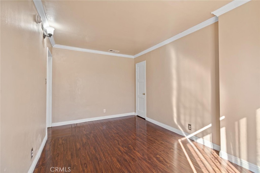 13438 Mercer Street Pacoima, CA 91331 - Photo 25 of 39 a view of an empty room with wooden floor