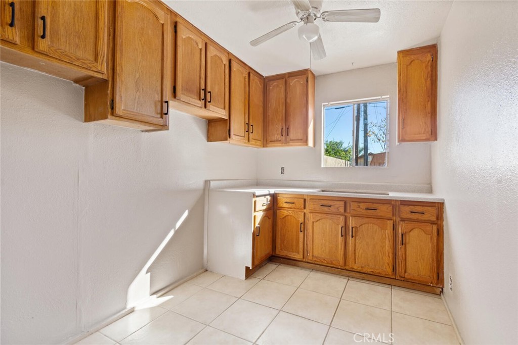 13438 Mercer Street Pacoima, CA 91331 - Photo 32 of 39 a kitchen with stainless steel appliances granite countertop a sink and a cabinets