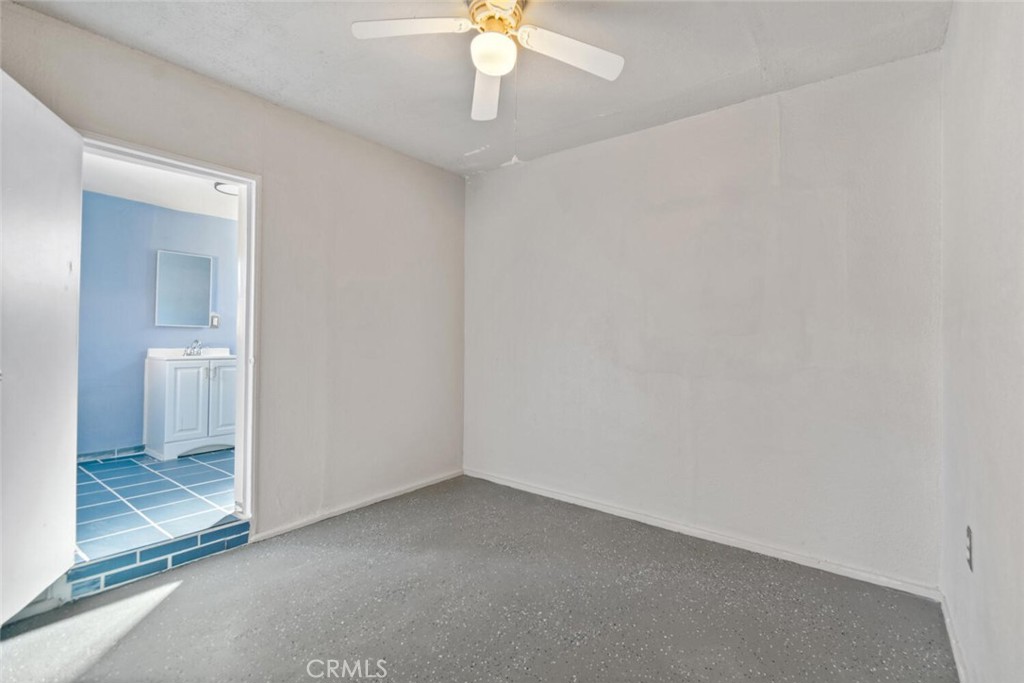 13438 Mercer Street Pacoima, CA 91331 - Photo 33 of 39 a view of a room with a ceiling fan and bathroom
