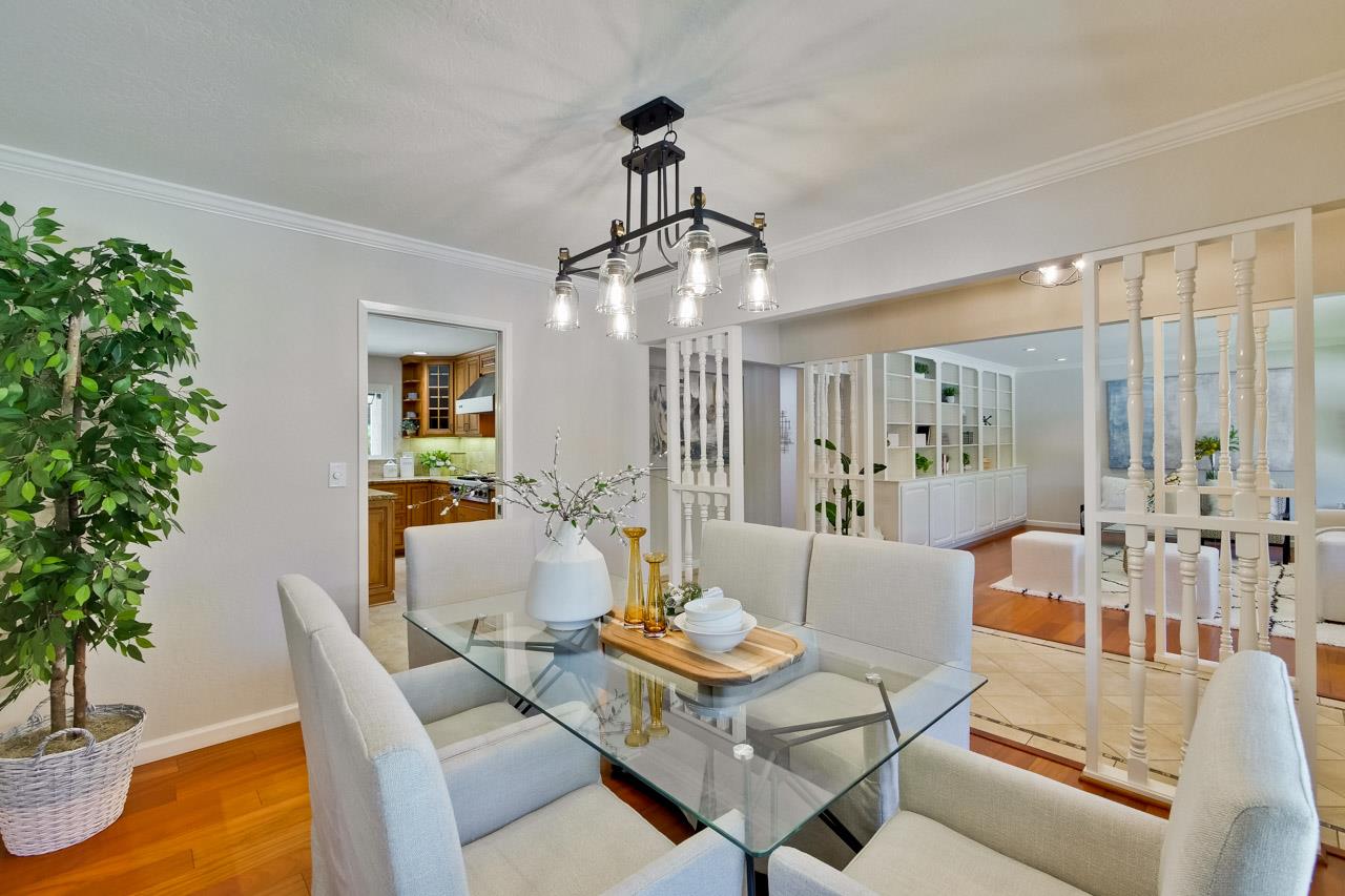 11131 Bubb Road Cupertino, CA 95014 - Photo 11 of 56 a living room with furniture and a potted plant