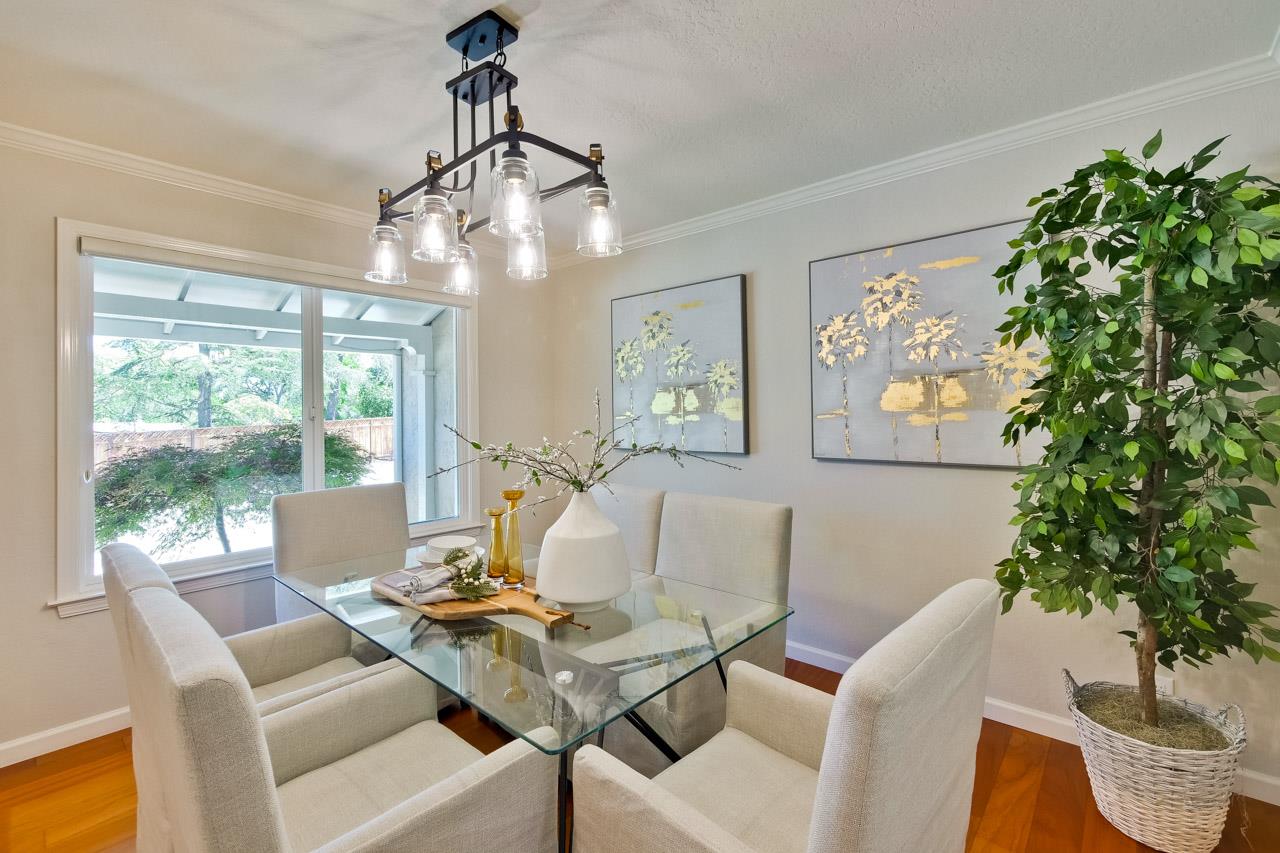 11131 Bubb Road Cupertino, CA 95014 - Photo 12 of 56 a living room with furniture a window and a chandelier