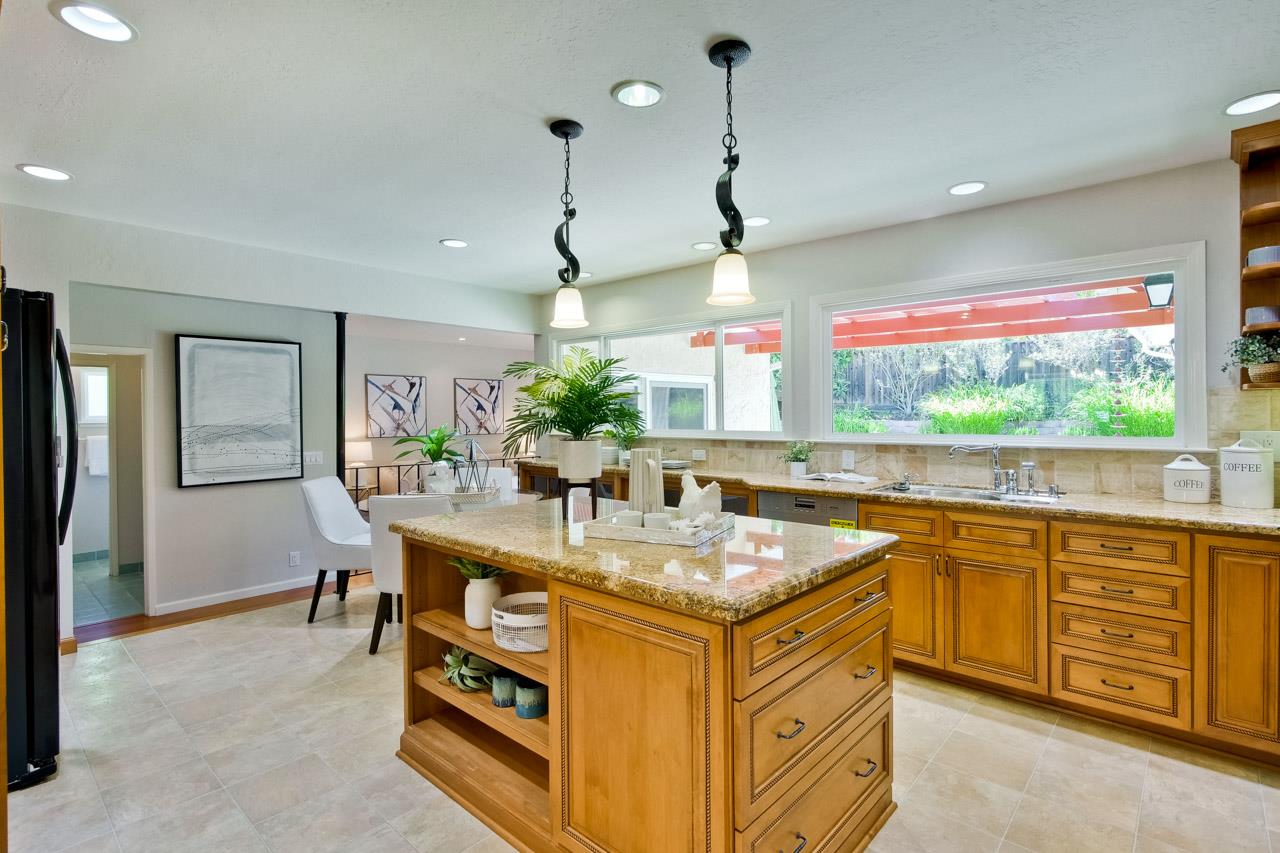 11131 Bubb Road Cupertino, CA 95014 - Photo 14 of 56 a kitchen that has a lot of counter space and a sink in it