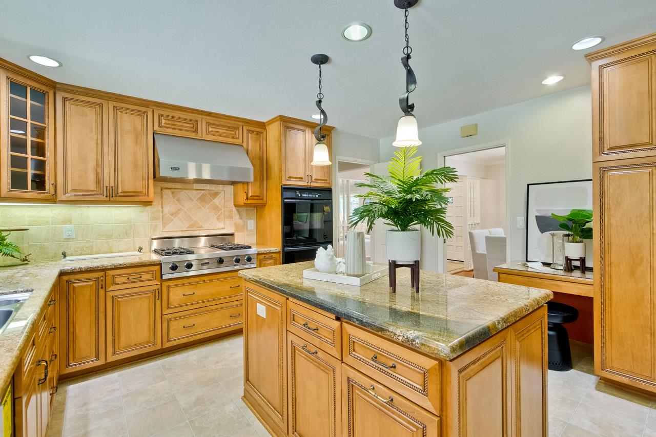 11131 Bubb Road Cupertino, CA 95014 - Photo 15 of 56 a kitchen with stainless steel appliances granite countertop a sink a stove and a wooden cabinets