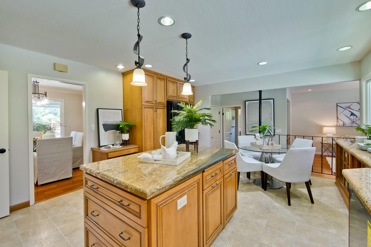 11131 Bubb Road Cupertino, CA 95014 - Photo 21 of 56 a room with kitchen island granite countertop furniture and a potted plant