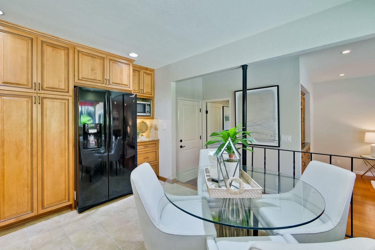 11131 Bubb Road Cupertino, CA 95014 - Photo 22 of 56 a dining room with furniture and a table